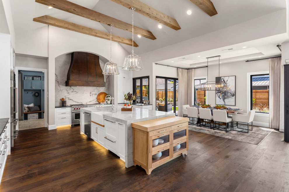 Inspiration for a large cottage dark wood floor, brown floor and exposed beam open concept kitchen remodel in Portland with white cabinets, marble countertops, gray backsplash, marble backsplash, stainless steel appliances, an island and gray countertops