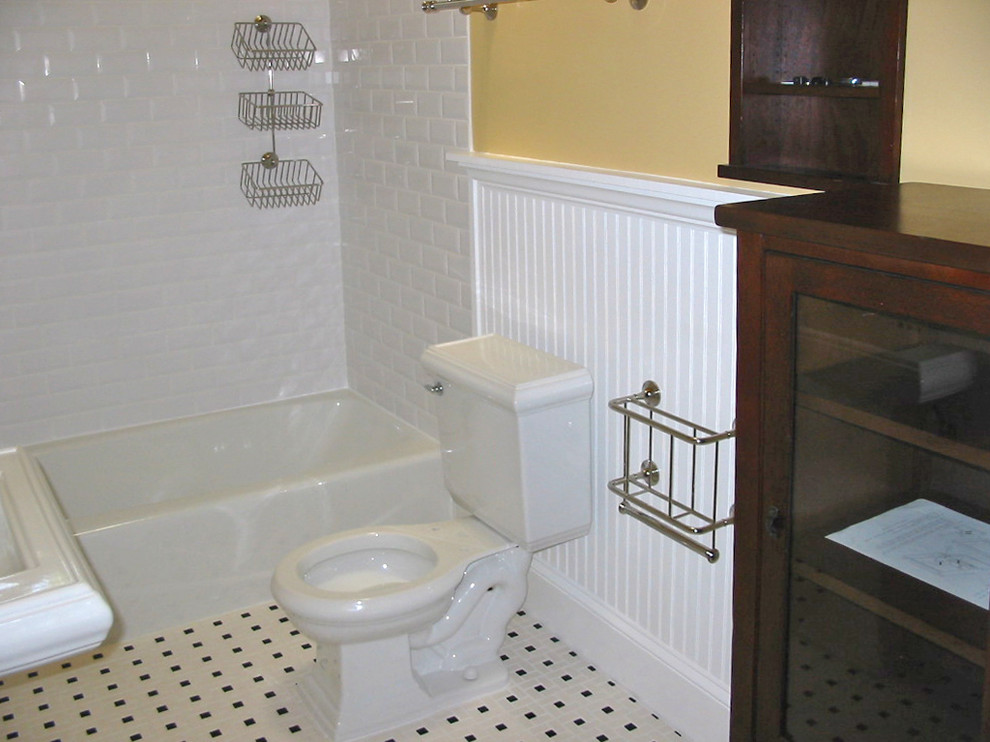 Design ideas for a traditional bathroom in Atlanta with an alcove tub, a shower/bathtub combo, white tile, subway tile, yellow walls and a pedestal sink.