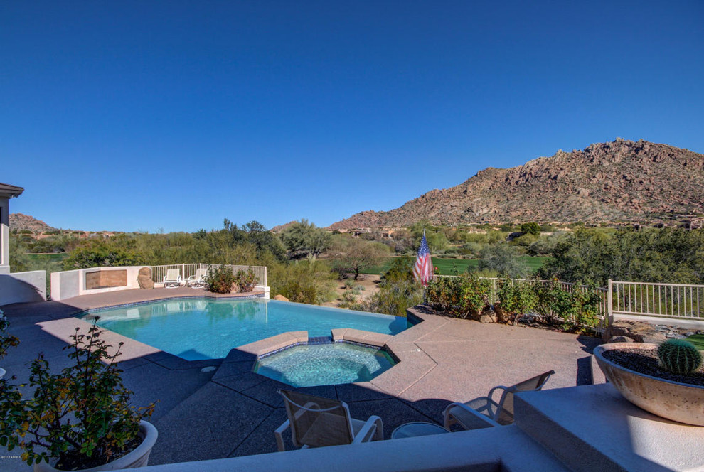 Design ideas for a backyard custom-shaped pool in Phoenix.