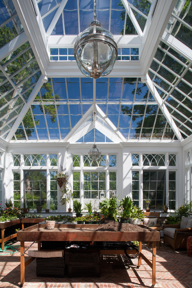 Mid-sized traditional sunroom in New York with a glass ceiling and brick floors.