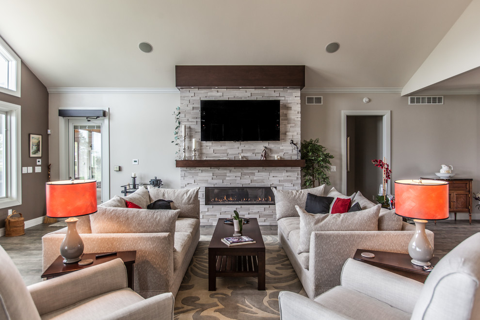 This is an example of a large transitional living room in Other with grey walls, porcelain floors, a stone fireplace surround, a wall-mounted tv, grey floor and a ribbon fireplace.