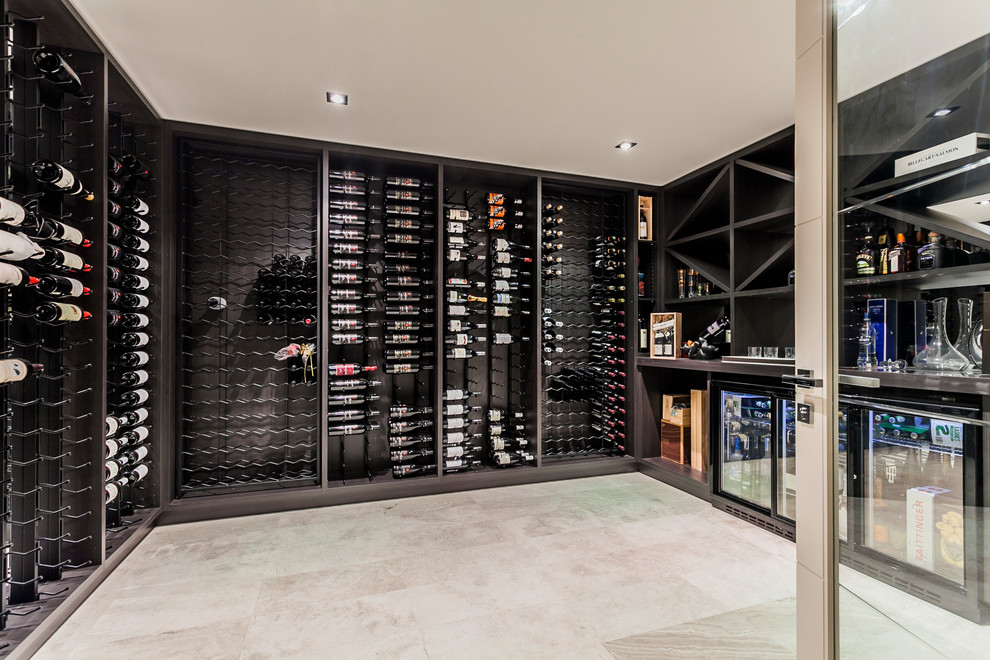 Inspiration for a contemporary wine cellar in Perth with storage racks and beige floor.