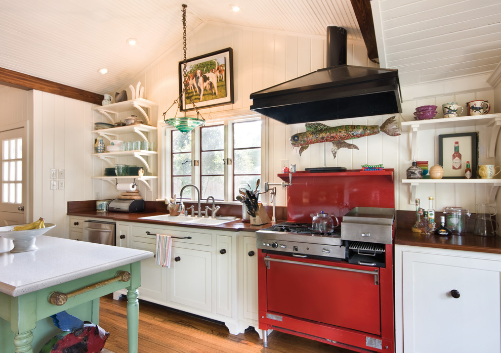 This is an example of an eclectic kitchen in New Orleans with coloured appliances.
