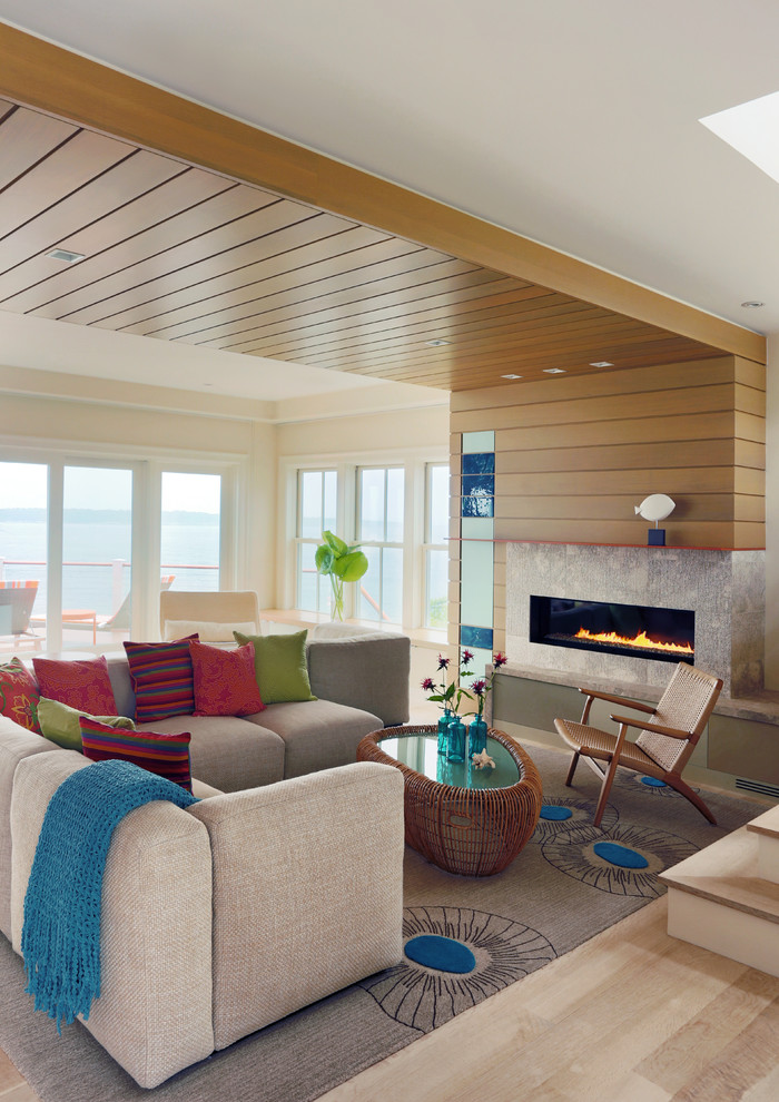 Inspiration for a coastal formal and open concept light wood floor living room remodel in Providence with beige walls, a ribbon fireplace and a tile fireplace