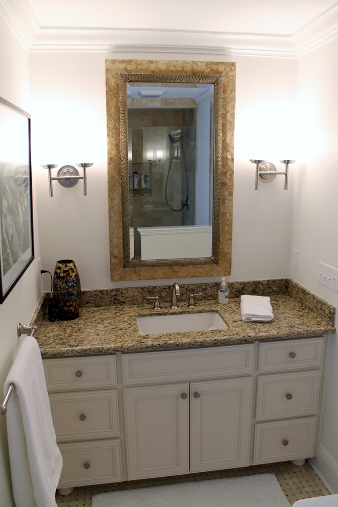 Mid-sized traditional 3/4 bathroom in Miami with an undermount sink, furniture-like cabinets, white cabinets, granite benchtops, multi-coloured tile, mosaic tile, white walls and mosaic tile floors.
