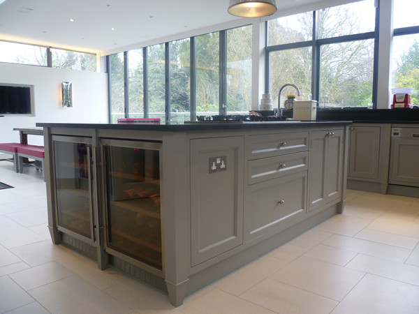 Contemporary kitchen in London with with island.