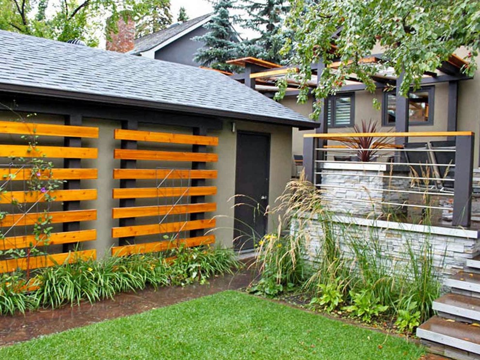 Design ideas for a small modern backyard garden in Calgary.