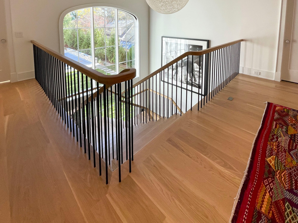 Inspiration for a huge modern wooden floating mixed material railing and shiplap wall staircase remodel in DC Metro