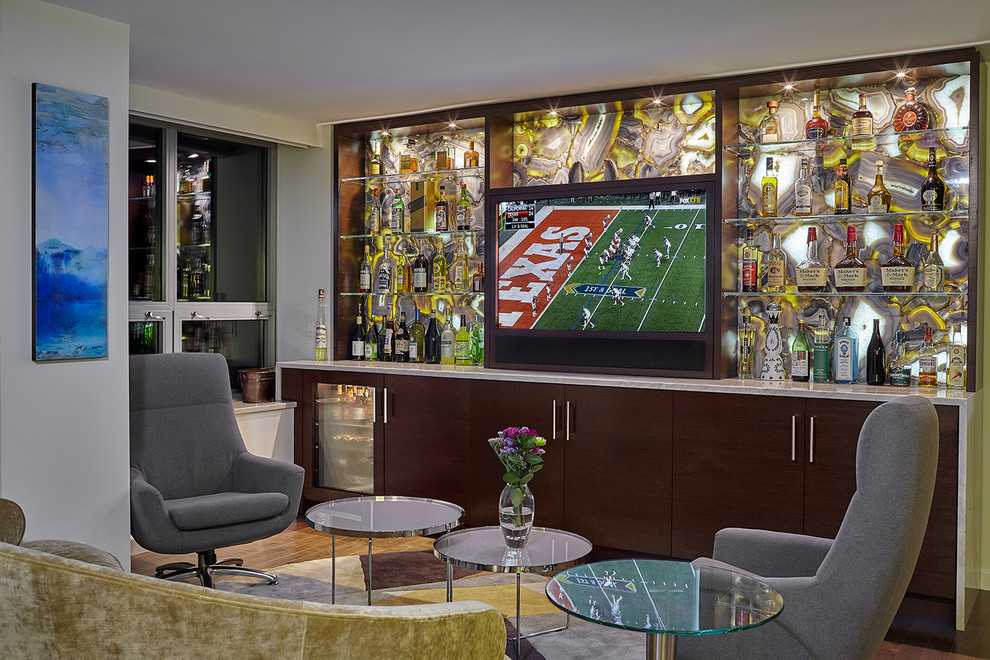This is an example of a mid-sized contemporary u-shaped seated home bar in Chicago with no sink, flat-panel cabinets, brown cabinets, granite benchtops, blue splashback, stone slab splashback and dark hardwood floors.