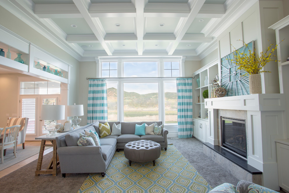 Inspiration for a mid-sized transitional open concept family room in Salt Lake City with beige walls, carpet, a standard fireplace, no tv and beige floor.