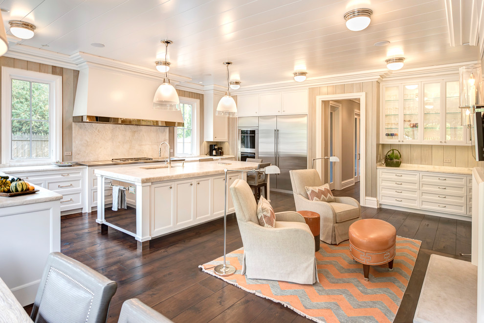 Inspiration for a large transitional u-shaped medium tone wood floor and brown floor open concept kitchen remodel with an undermount sink, shaker cabinets, white cabinets, marble countertops, stainless steel appliances and an island