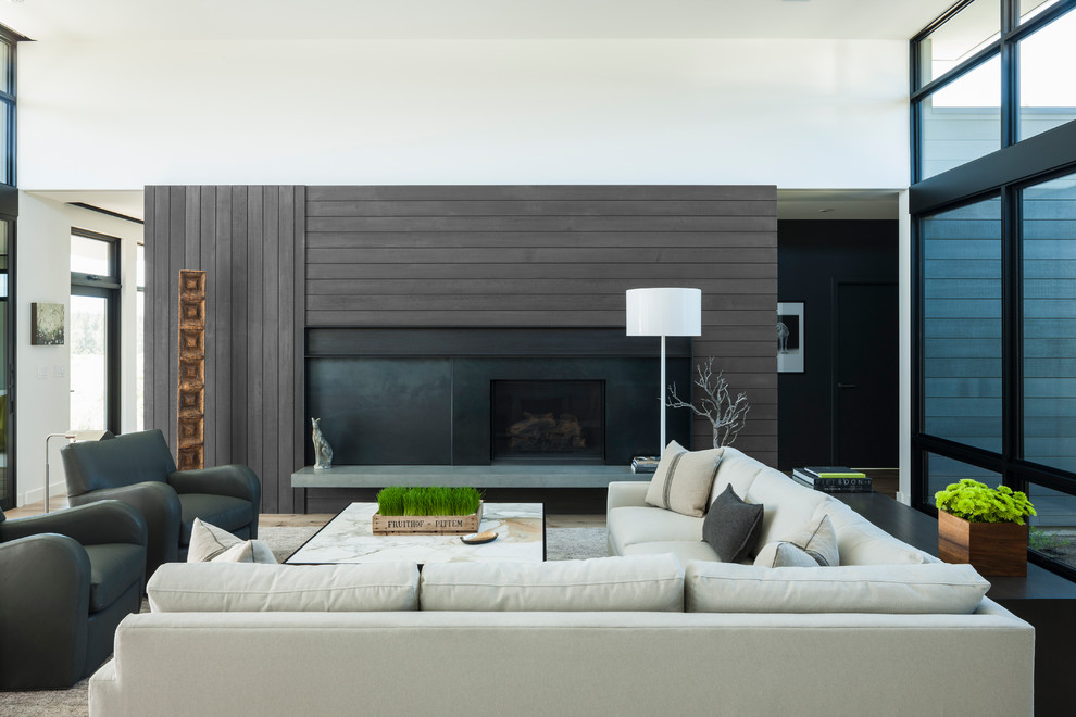Mid-sized modern formal open concept living room in Other with a standard fireplace and a metal fireplace surround.