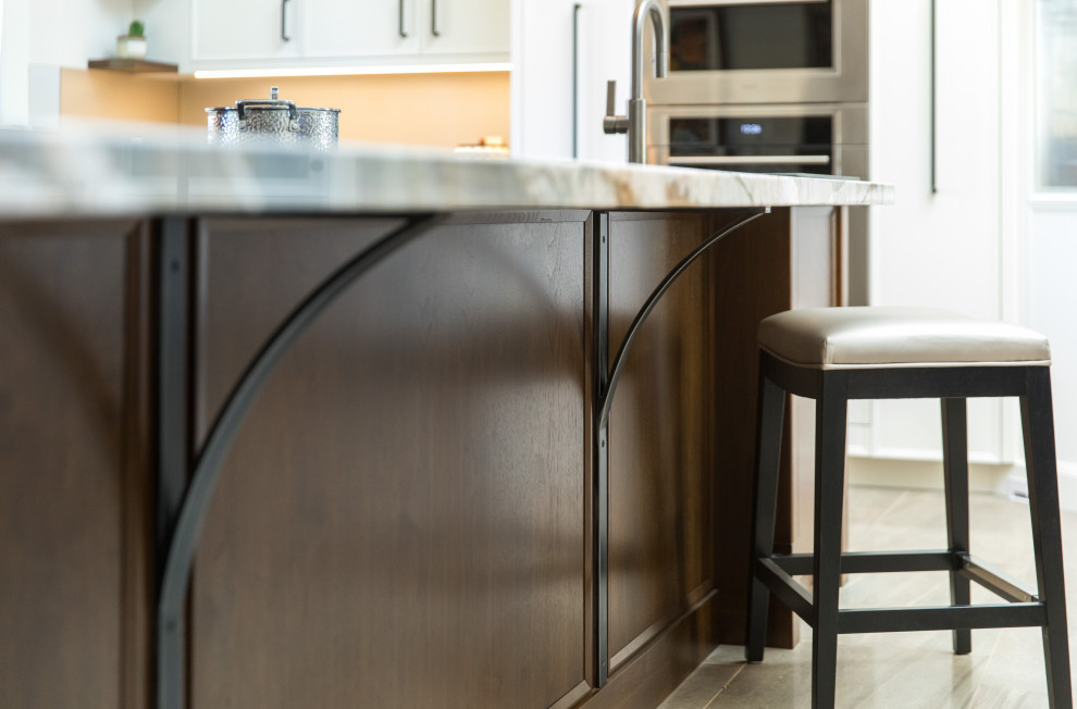 Example of a transitional kitchen design in Calgary