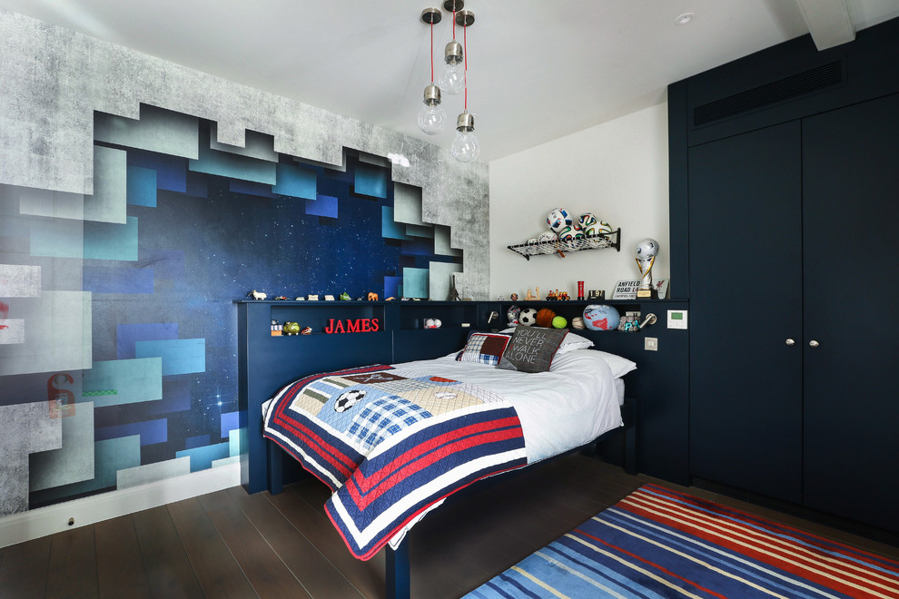 Photo of a mid-sized contemporary kids' bedroom for kids 4-10 years old and boys in London with white walls, dark hardwood floors and brown floor.