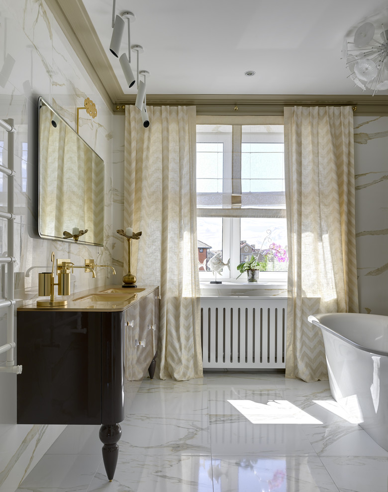 Photo of a transitional master bathroom in Other with a freestanding tub, white tile, porcelain tile, porcelain floors, a trough sink, glass benchtops, yellow benchtops, flat-panel cabinets and white floor.