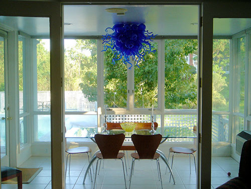Photo of a mid-sized contemporary dining room in DC Metro with porcelain floors.