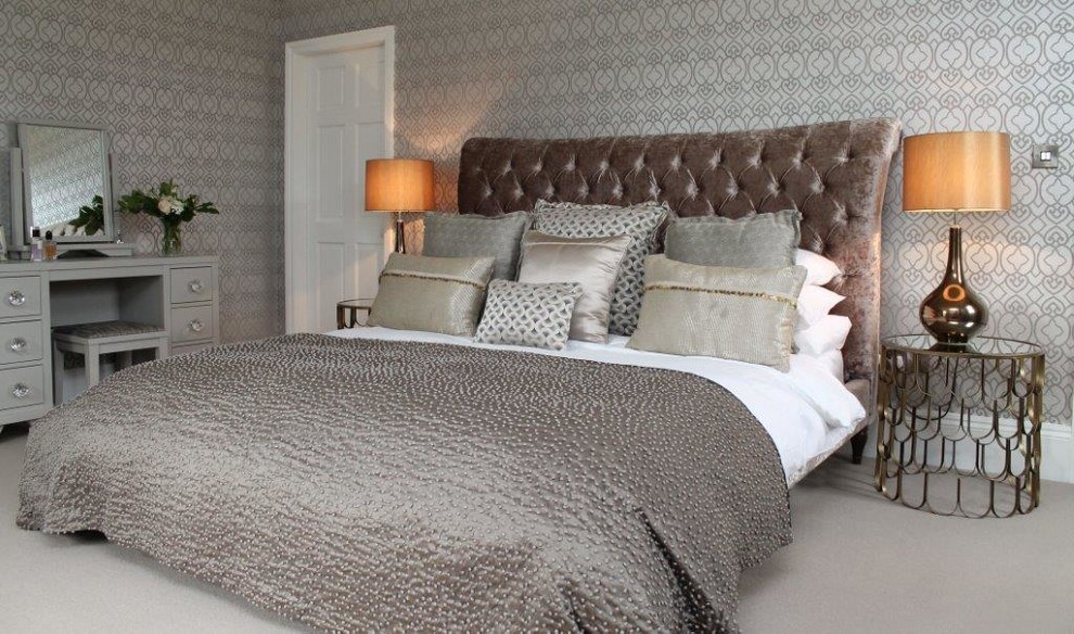 Inspiration for a transitional master bedroom in Other with beige walls and carpet.
