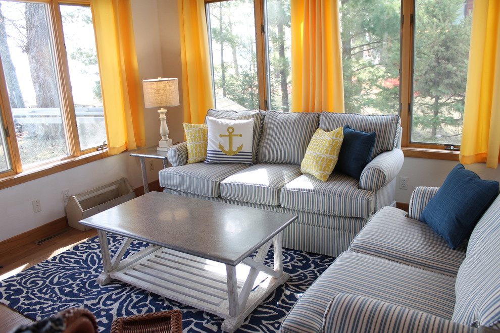 Design ideas for a small beach style sunroom in Minneapolis with light hardwood floors.