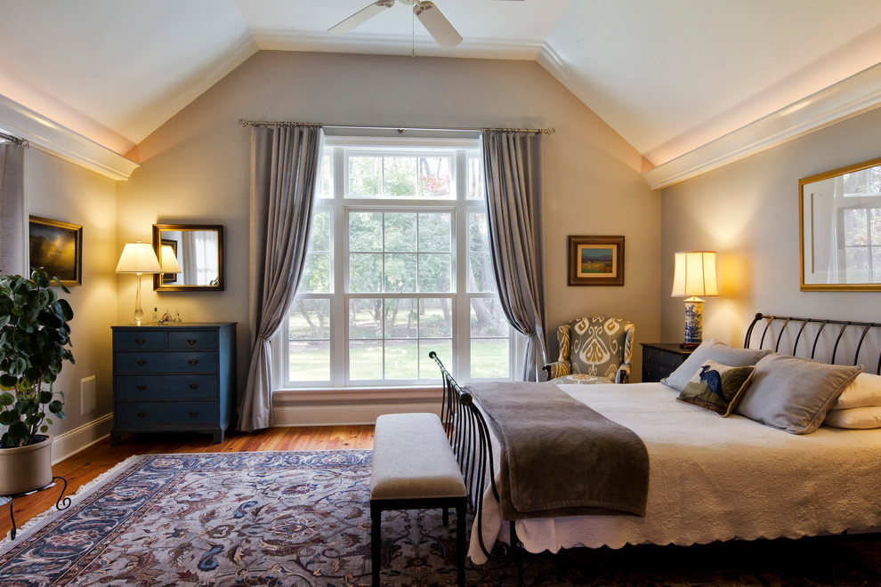 Design ideas for a large traditional master bedroom in New York with grey walls and medium hardwood floors.