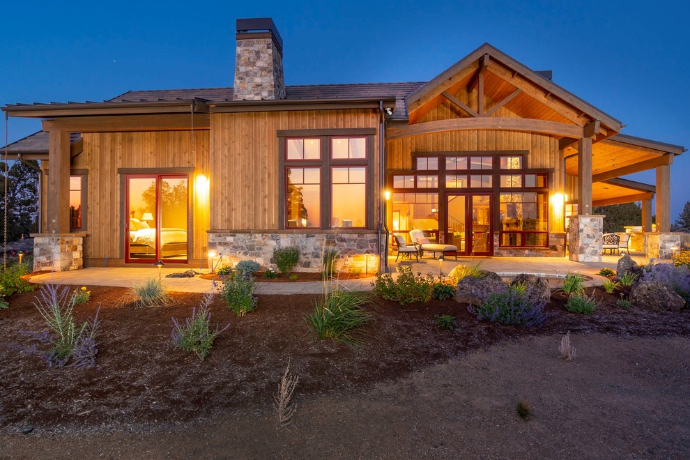 Large rustic brown two-story wood gable roof idea