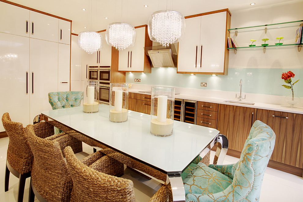 Design ideas for a large traditional galley kitchen/diner with a single-bowl sink, flat-panel cabinets, medium wood cabinets, granite worktops, beige splashback, ceramic splashback, stainless steel appliances, ceramic flooring and no island.
