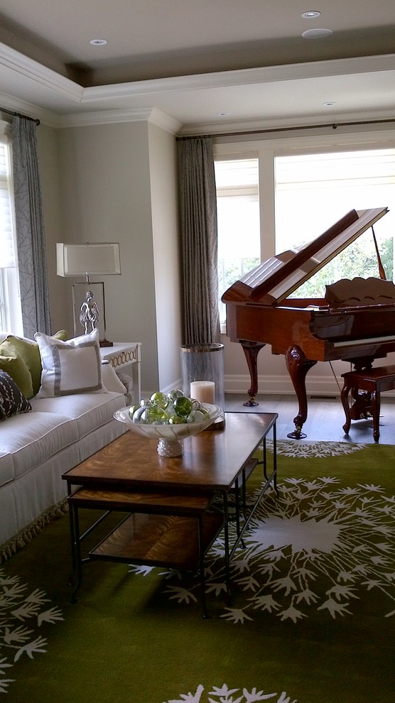 Large transitional open concept medium tone wood floor home design photo in Toronto with beige walls
