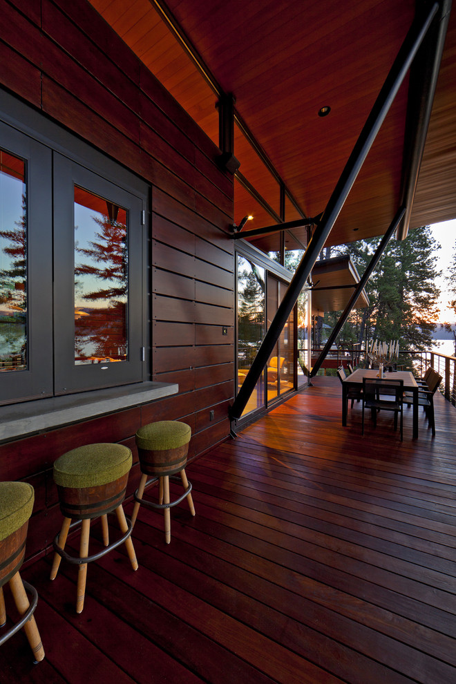 Design ideas for a contemporary deck in Seattle with a roof extension.
