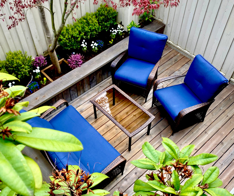 Deck - small rustic backyard ground level deck idea in Vancouver with no cover