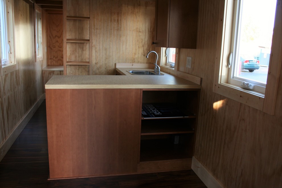 Example of a small mountain style l-shaped eat-in kitchen design in Seattle with laminate countertops, stainless steel appliances and no island