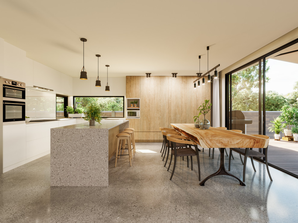 This is an example of a mid-sized modern kitchen/dining combo in Melbourne with beige walls, concrete floors and grey floor.