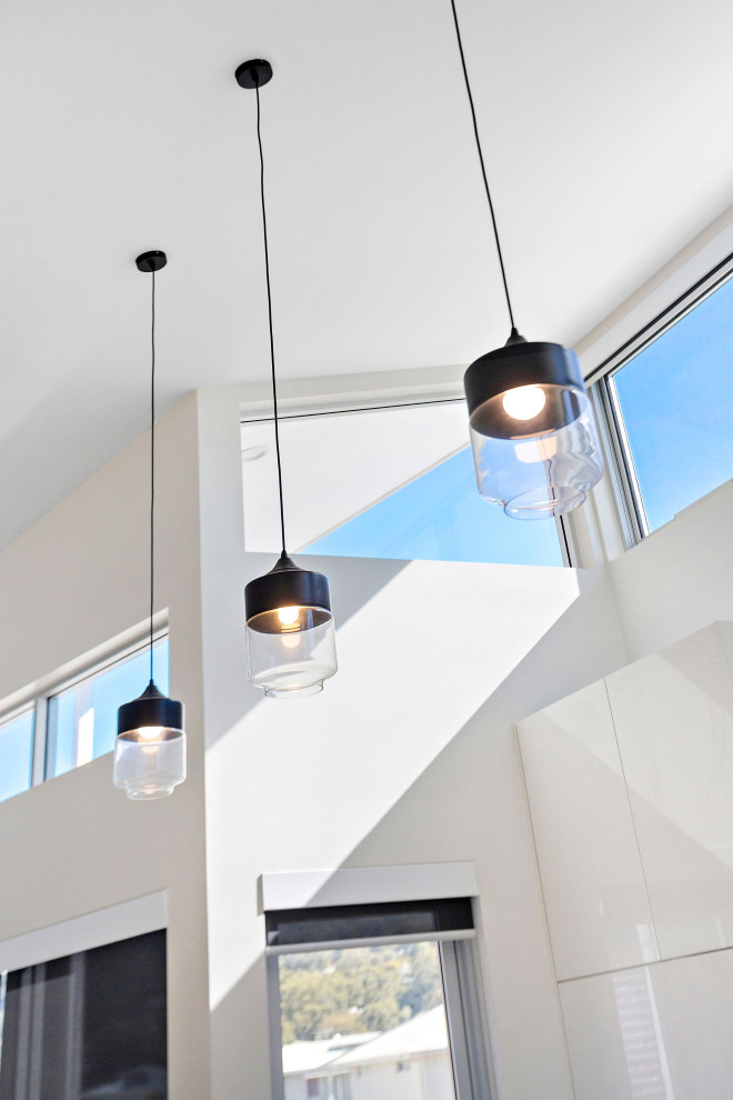 This is an example of a beach style kitchen in Wollongong.