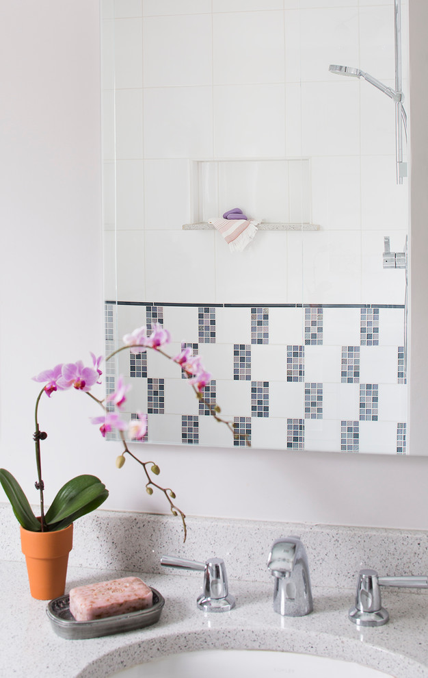 Inspiration for a transitional kids bathroom in Boston with an undermount sink, shaker cabinets, white cabinets, terrazzo benchtops, an alcove shower, a two-piece toilet, white tile, porcelain tile, pink walls and porcelain floors.