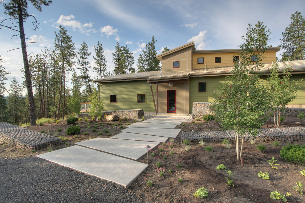 Contemporary green two-story exterior home idea in Seattle