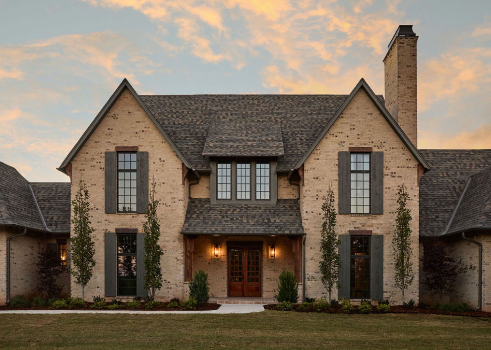 Example of a farmhouse exterior home design in Oklahoma City