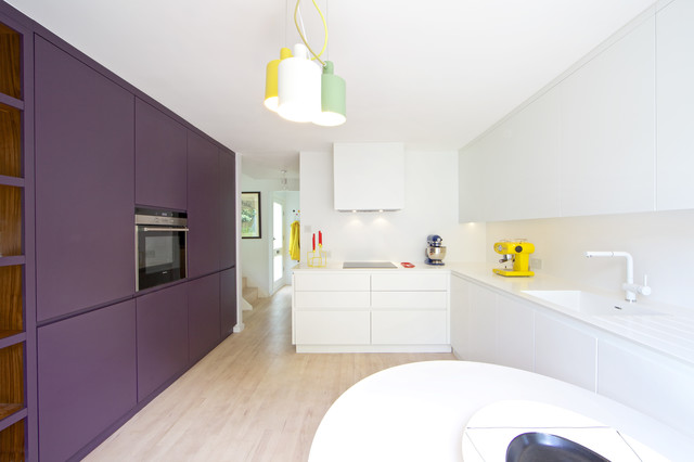 Rich Color Adds Depth To A Modern White Kitchen