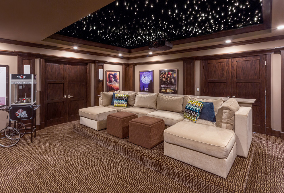 Photo of a traditional enclosed home theatre in Chicago with beige walls, carpet and multi-coloured floor.