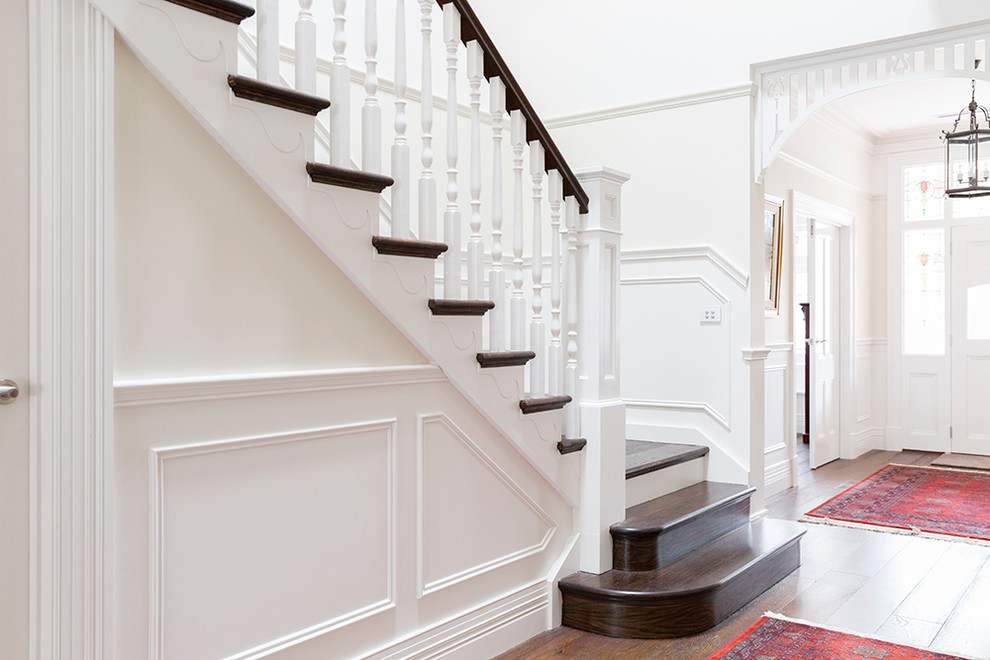 Mid-sized traditional wood straight staircase in Melbourne with wood risers.
