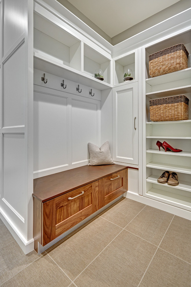 Inspiration for a small transitional galley utility room in Sacramento with recessed-panel cabinets, white cabinets, quartz benchtops, white splashback, porcelain splashback, grey walls and porcelain floors.