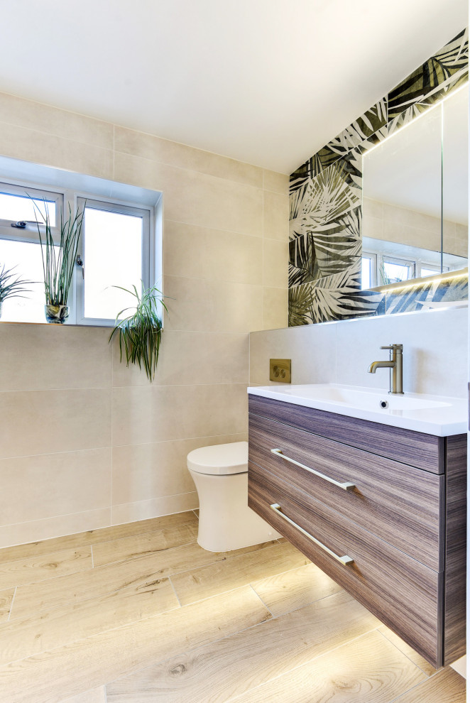 Photo of a mid-sized tropical master bathroom in Sussex with flat-panel cabinets, medium wood cabinets, an open shower, a two-piece toilet, beige tile, ceramic tile, beige walls, wood-look tile, a drop-in sink, tile benchtops, brown floor, beige benchtops, a single vanity and a floating vanity.