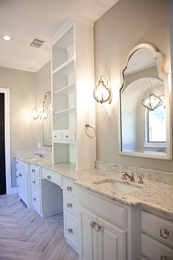 This is an example of a large arts and crafts master bathroom in Austin with furniture-like cabinets, white cabinets, a freestanding tub, a curbless shower, a two-piece toilet, white walls, concrete floors, an undermount sink, granite benchtops, brown tile and ceramic tile.