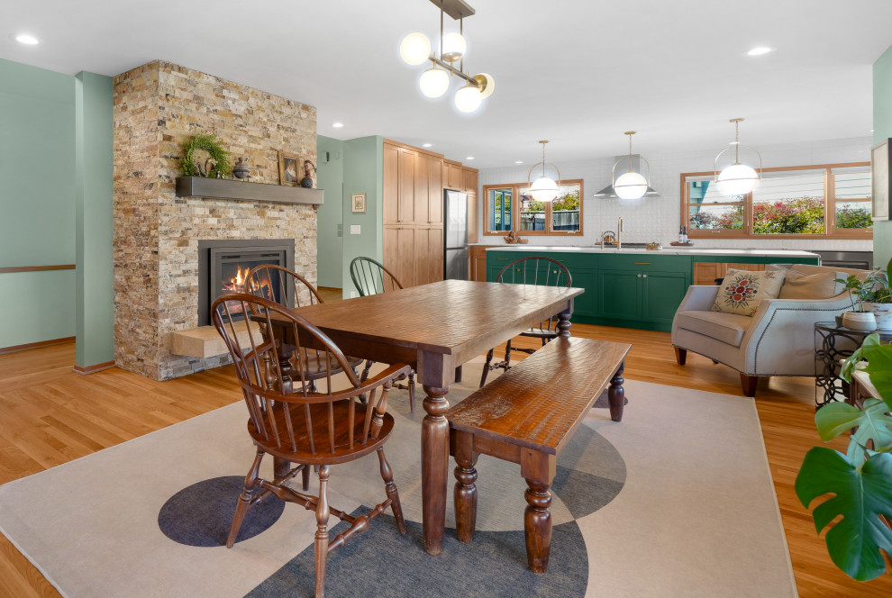 Example of a transitional l-shaped medium tone wood floor kitchen design with shaker cabinets, white backsplash, an island and white countertops
