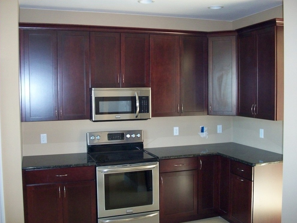 Photo of a small transitional l-shaped separate kitchen in Other with no island.