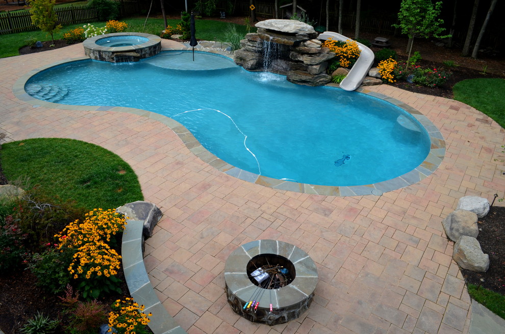 Inspiration for a huge transitional backyard concrete paver and custom-shaped natural pool fountain remodel in DC Metro