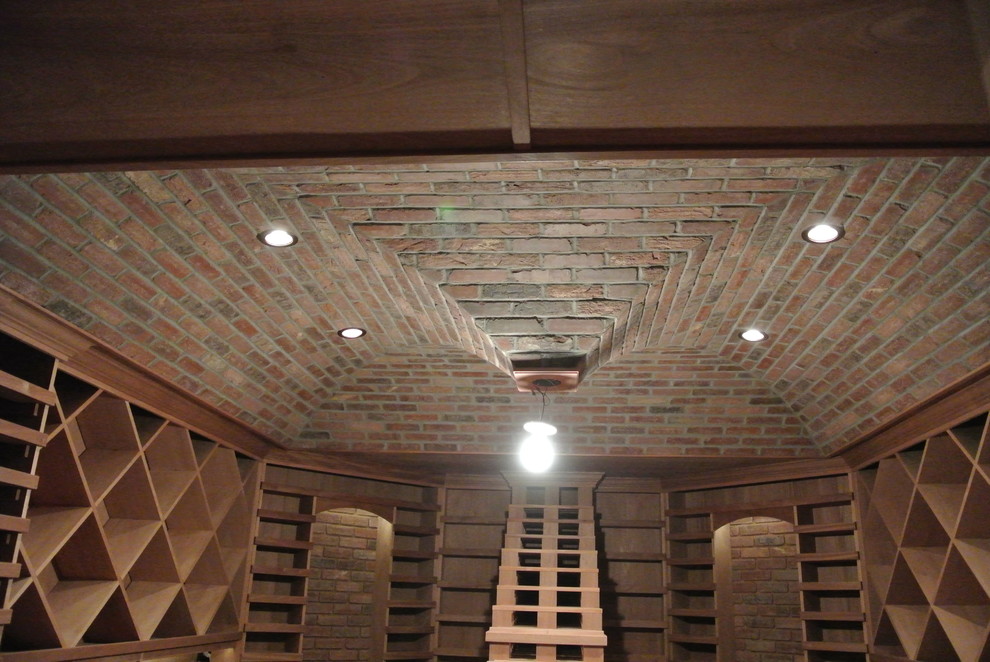 This is an example of a large traditional wine cellar in New York with diamond bins.