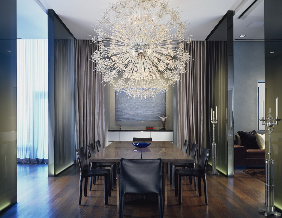 Contemporary dining room in Chicago with dark hardwood floors.