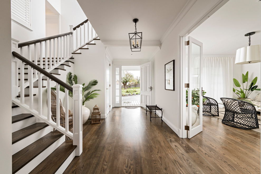 Design ideas for a large transitional entry hall in Perth with white walls, dark hardwood floors, a single front door, a white front door and brown floor.
