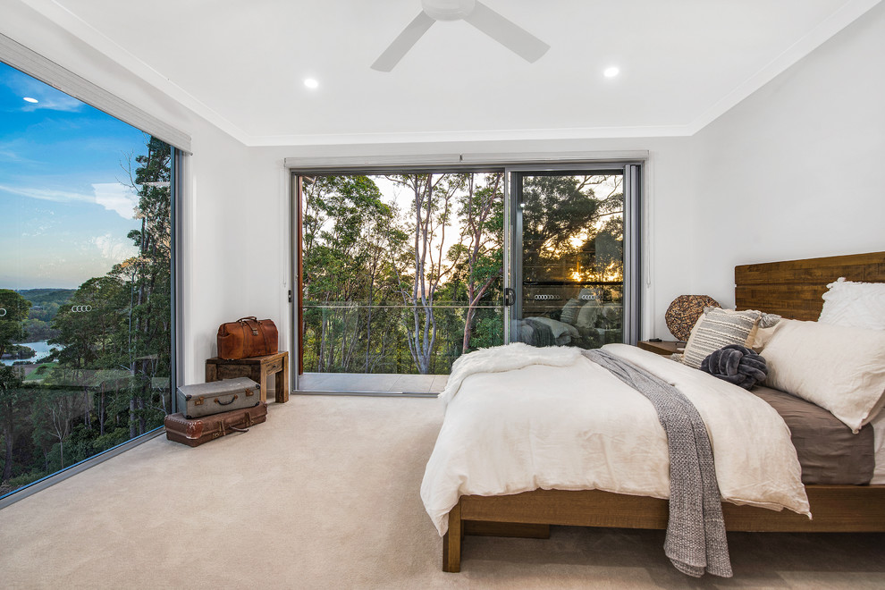 Contemporary master bedroom in Brisbane with grey walls, carpet and beige floor.