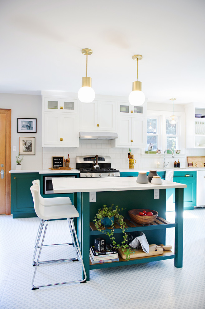 This is an example of a large transitional separate kitchen in Other with shaker cabinets, marble benchtops, white splashback, ceramic splashback, stainless steel appliances, porcelain floors, with island, multi-coloured floor, turquoise cabinets and white benchtop.