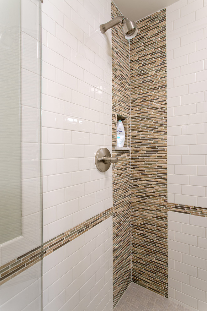 Inspiration for a country master bathroom in Boston with beaded inset cabinets, medium wood cabinets, a corner shower, a wall-mount toilet, white tile, subway tile, an integrated sink and marble benchtops.