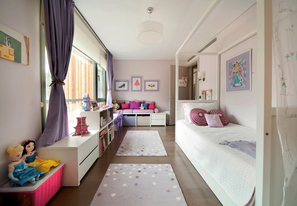 Photo of a contemporary kids' bedroom for kids 4-10 years old and girls in Other with pink walls.